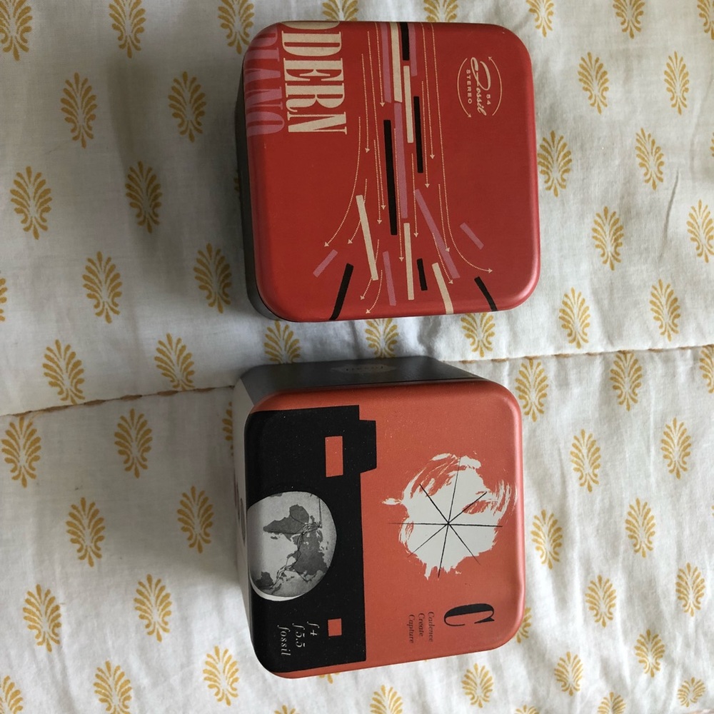 Two fossil watch tins